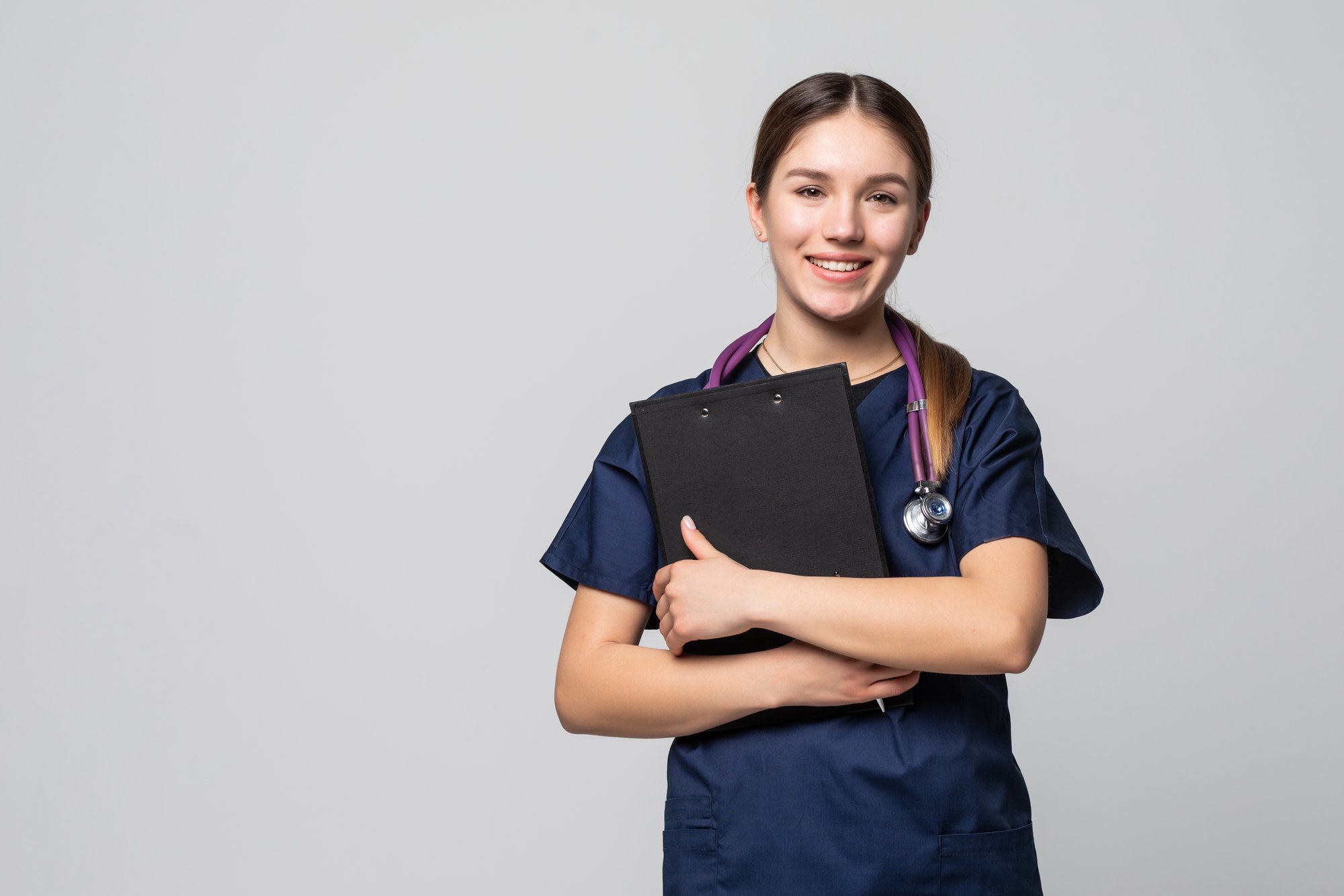 female-doctor-holding-clipboard-isolated-white